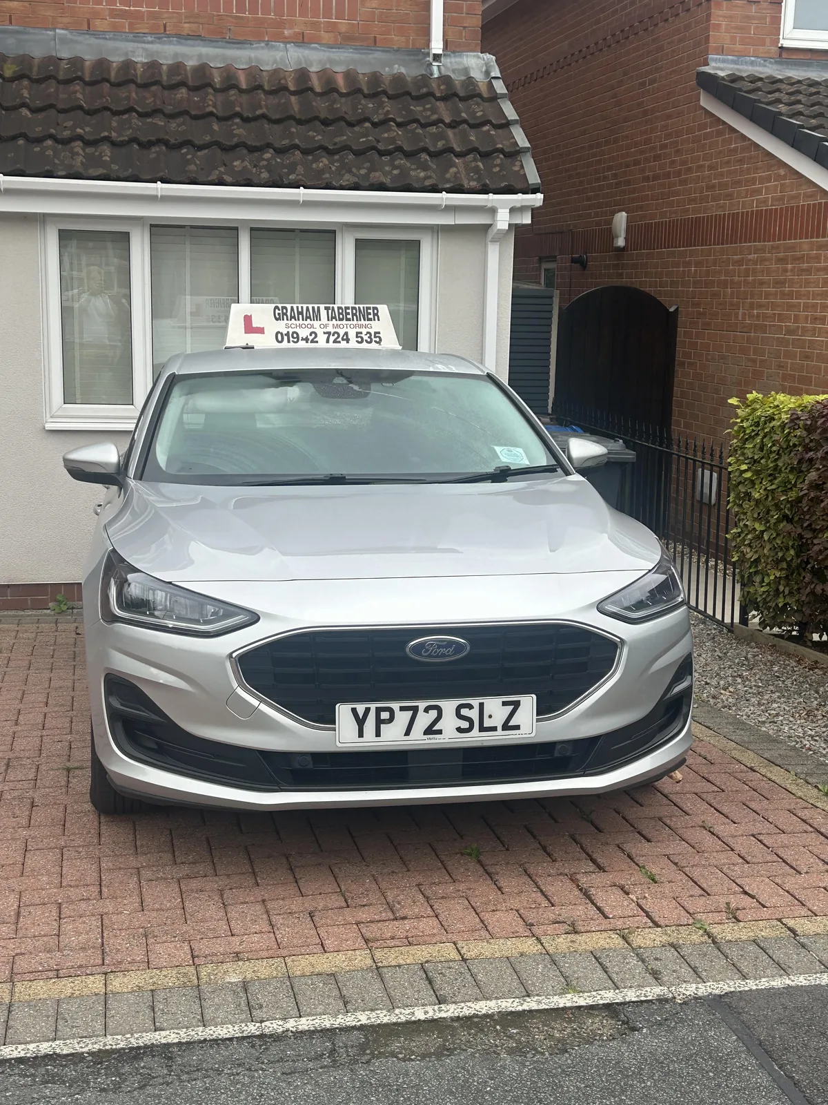 Graham Taberner’s silver Ford tuition car with its branded learner roof sign